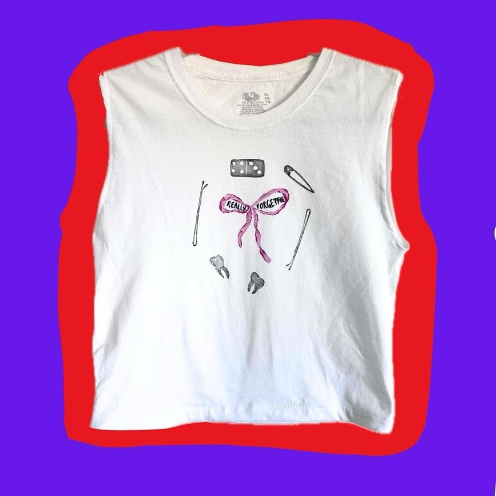 ✨One-of-a-kind✨ stamped with fabric paint on a thrifted and reworked t-shirt.